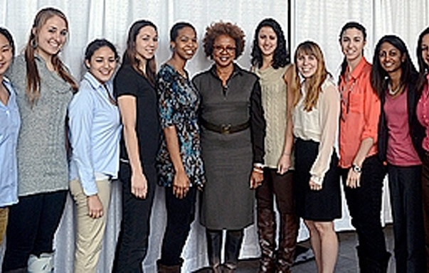 Paula Madison (center) poses with the MIT women's basketball team.