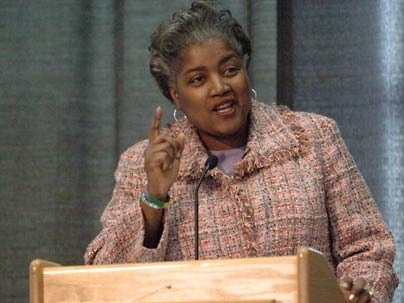 Donna Brazile gestures at a podium